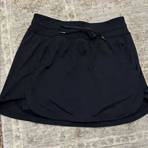 Travis Mathew black move knit skirt